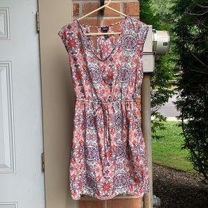 Beautiful pattern colorful dress with back cutouts/detailing. Medium